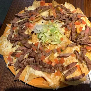 a plate of nachos on a table