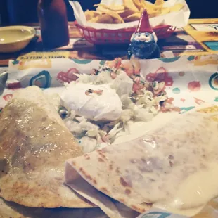 a plate of mexican food on a table