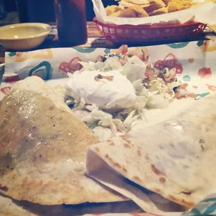 a plate of mexican food on a table
