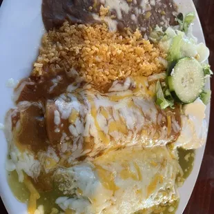 Enchilada plate, verde with shredded beef and Roja, red sauce with shredded chicken.
