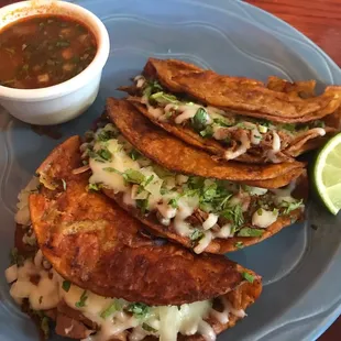 Birria Tacos! On the special board on Sunday July 25, 2021. Very filling! Paid extra for cheese. Dipping sauce was flavorful not greasy.