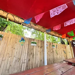a patio with a table and chairs