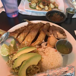Pampano fried fish with tortillas, slaw and rice