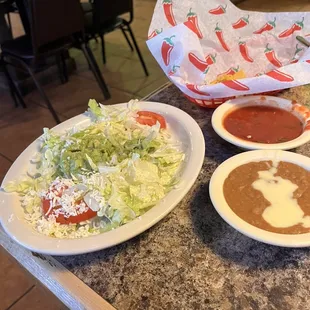 two plates of mexican food on a table