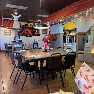 a dining area with tables and chairs