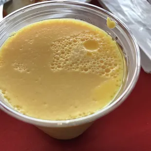 a smoothie in a plastic cup