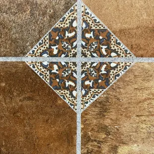 a closeup of a decorative tile