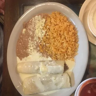 2 ground beef enchilada combo dinner with queso cheese sauce