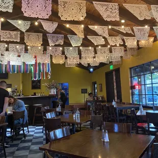people sitting at tables in a restaurant