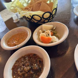 Chips and Salsa and pickled veggies. The orange salsa is different but really good.