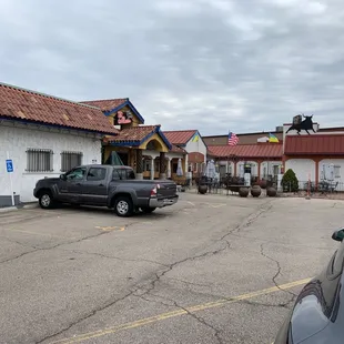 a car parked in front of a restaurant