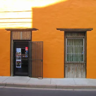 non-descript. Follow the street number or just watch for the patrons!