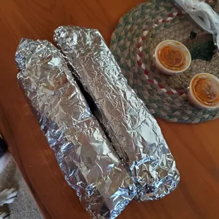 2 breakfast burritos with egg, bean, bacon and potatoes