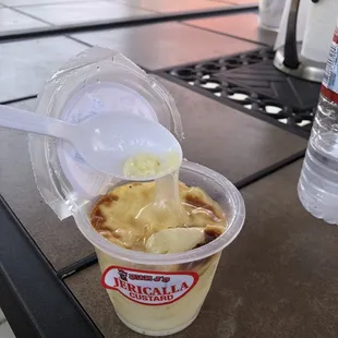 a cup of ice cream with a spoon in it