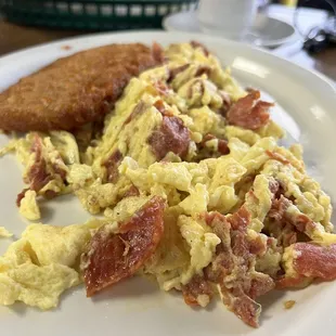 a plate of scrambled eggs and sausage