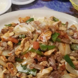 Yes there's a baked potato underneath all of the fajita goodness.