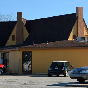 cars parked in front of a restaurant