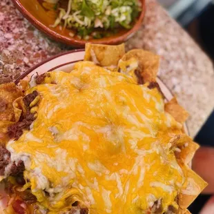 Cheese  nachos, with beans and meat huge platter with jalapeños on the side ;)