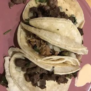 Carne Asada and Carnitas tacos.