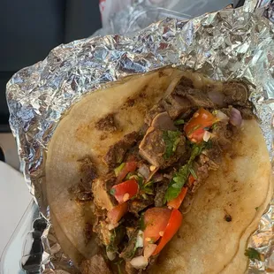 a burrito wrapped in foil