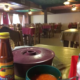 a table with soup and condiments