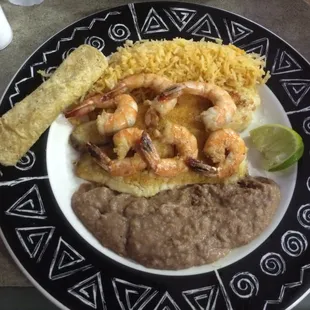 Tilapia and shrimp special with rice and refried beans