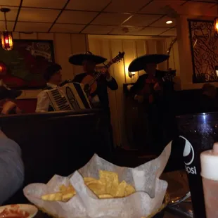 a mexican band playing in the background