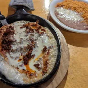 a skillet of food on a table