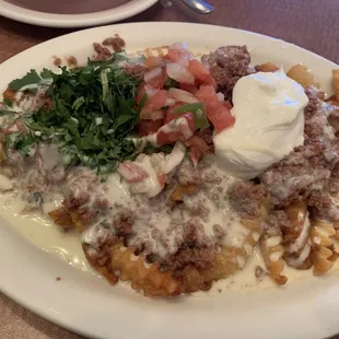 Not on the menu: queso fries with ground beef