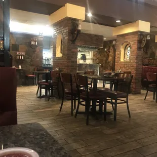 a view of a restaurant with tables and chairs