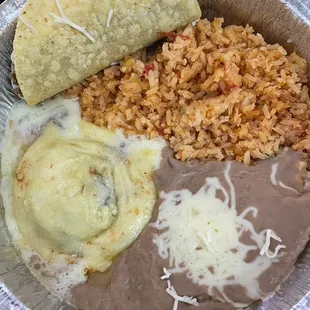 Lunch special - taco, rice/beans, and pile of cheese... aka, chili relleno