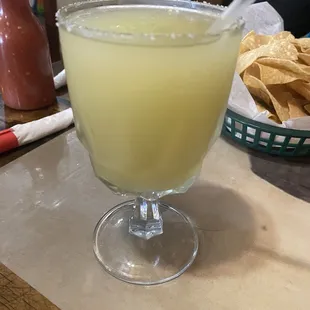 a margarita in a glass on a table