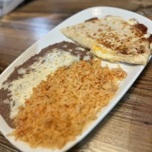 My sons cheese enchilada with rice and beans 10/10