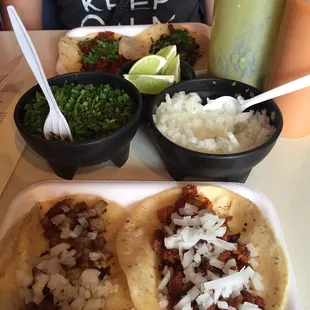 Two pastores tacos with onions &amp; cilantro &amp; limes