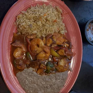 Camarones Rancheros y pulpo.  The sauce is flavorful with a little spice.