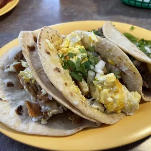 Migas, eggs and papas , Barbacoa tacos