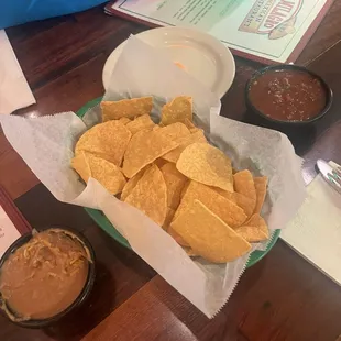 Complimentary chips with salsa and refried beans