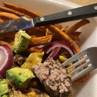 a plate of food with a knife and fork