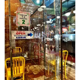 Inside Taqueria El Milagro.Pilsen. SocialDistancing/Dine In Plexiglass Boxes or Take Out. Entry  Mask /Temperature Check Required! Cool!