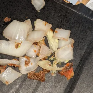 chopped onions and meat on a cutting board