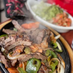 a plate of steak and vegetables