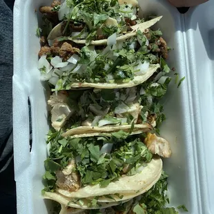 tacos in a styrofoam container