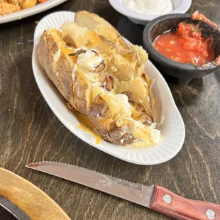 Had a bite but you can see how big the portions are. Ribs were fall off the bone. sauce on the side.delicious!!