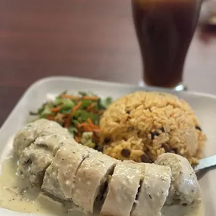 Pechuga relleno mofongo and yellow rice and pigeon peas. Yummy!  Tamarind juice is exceptional!