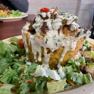 a plate of food with salad