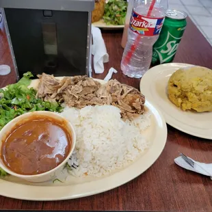 Pernil, mofongo with beans and rice.