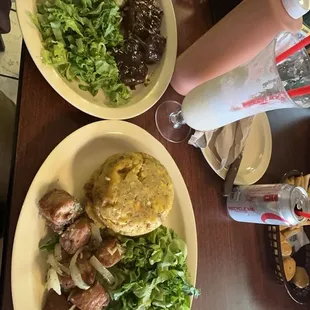 Mofongo con carne frita. Churrasco y  arroz con gandules