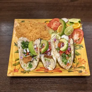 Try our tasty Fish tacos, served with rice and a salad