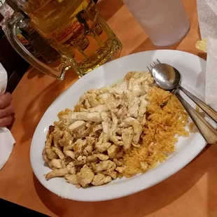 a plate of food and a glass of beer