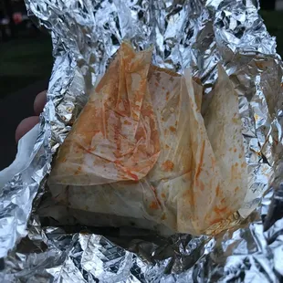 a piece of food wrapped in foil